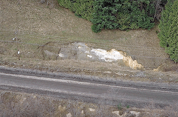 surficial slough on the roadside about 900 feet east of Dam Number Three